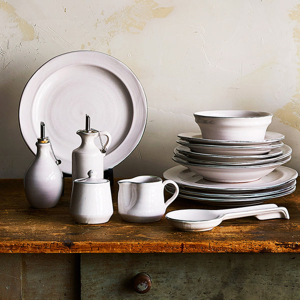 light-tableware-stacked-on-wooden-table